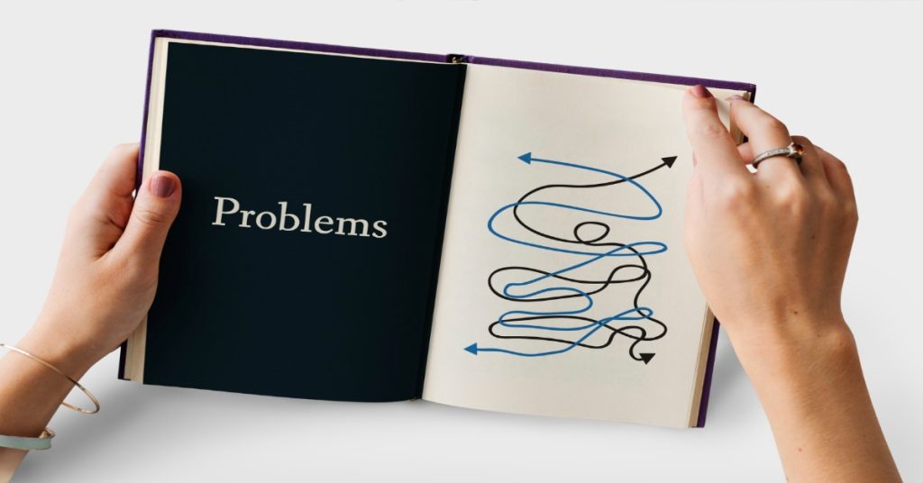 A page of a book with the title, Problems with arrows on the other page to illustrate problems faced while designing the survey.