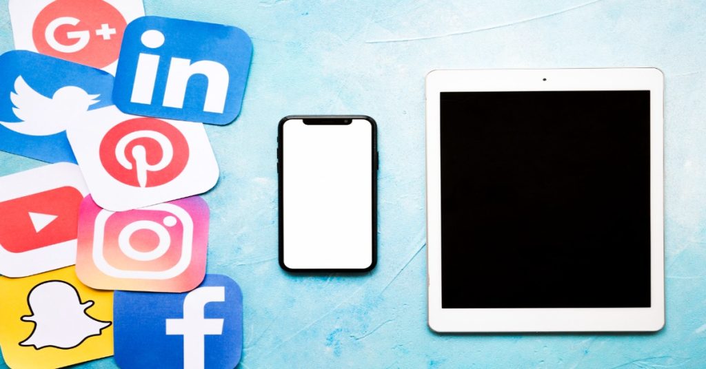Image of a tablet and smartphone on a blue background, representing social media marketing for survey reach.