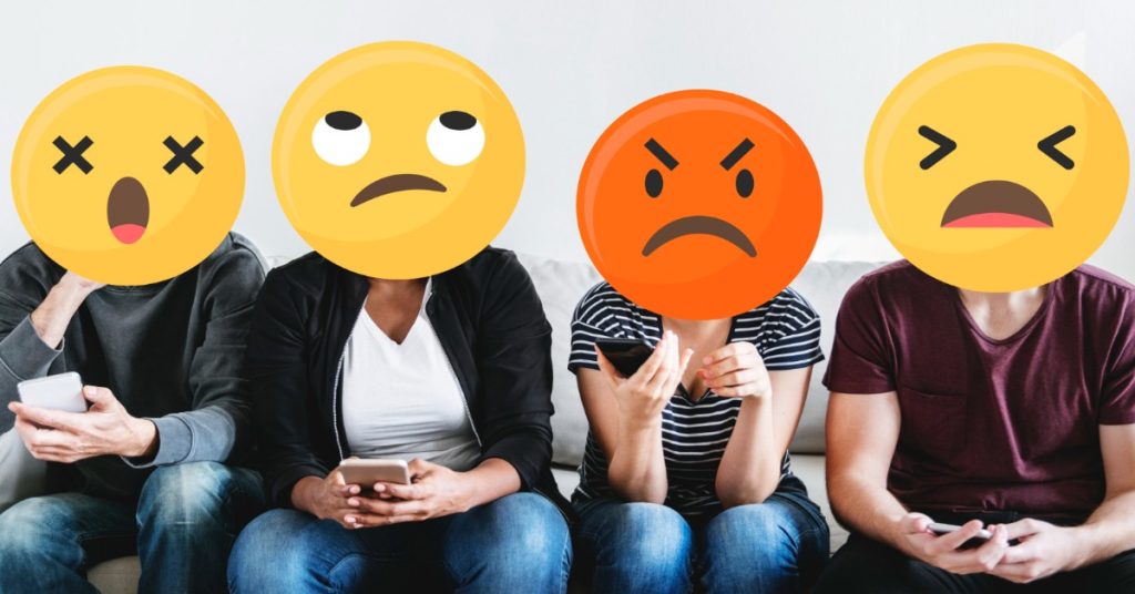 Four people displaying various emotions, representing customer review analysis for sentiment classification using ML models.