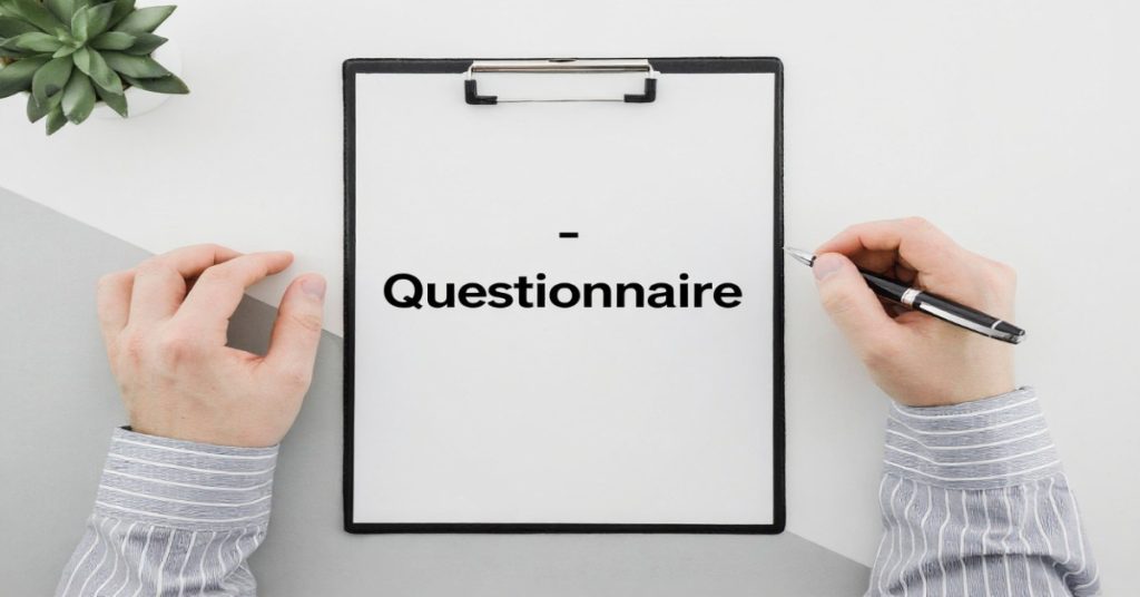 A questionnaire being filled by a person representing the benefits of using questionnaires in research.